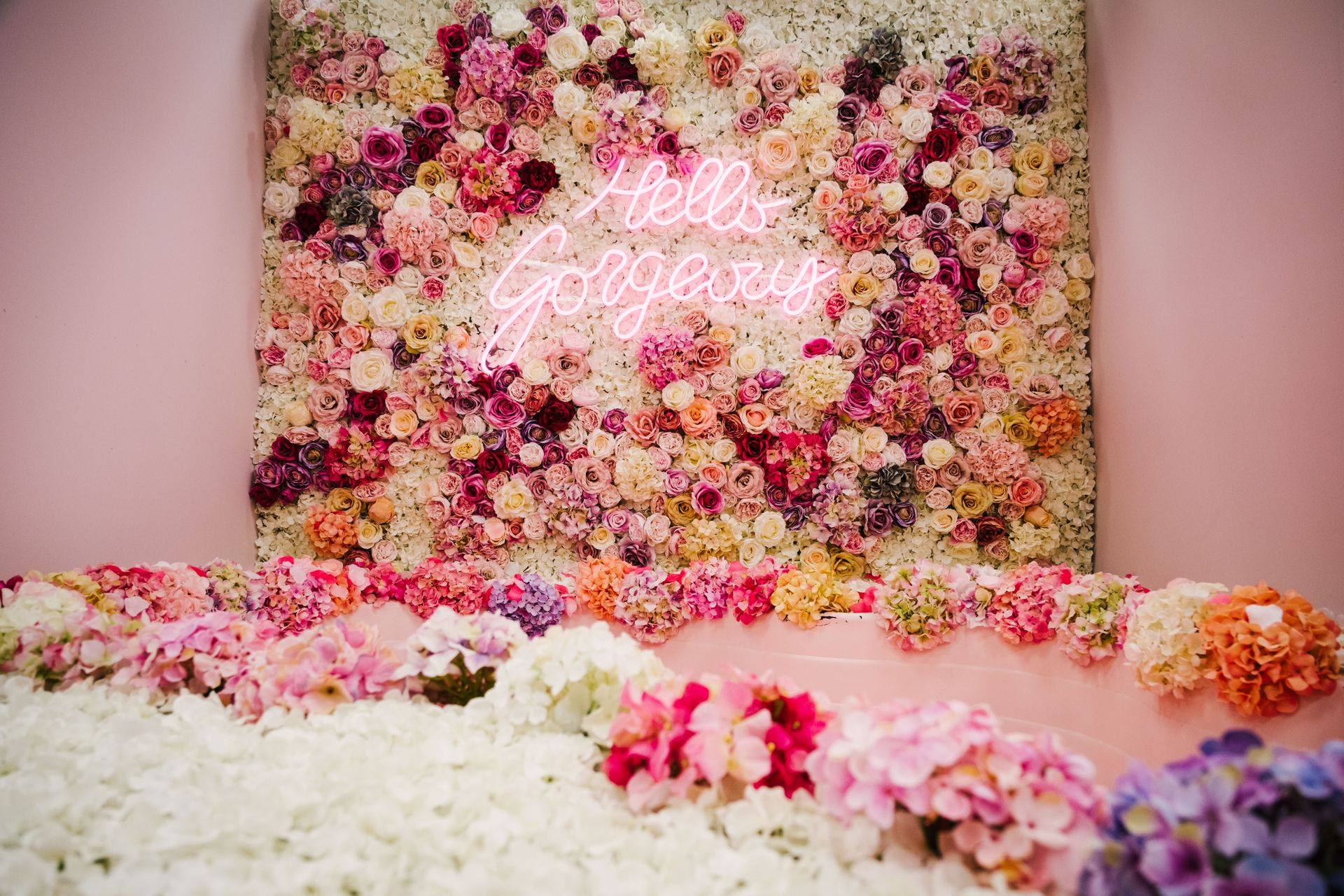 Hello Gorgeous Flower Wall with neon sign hire