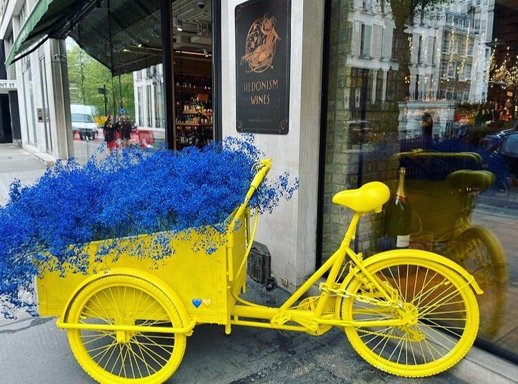 Hire this yellow and blue floral delivery bike